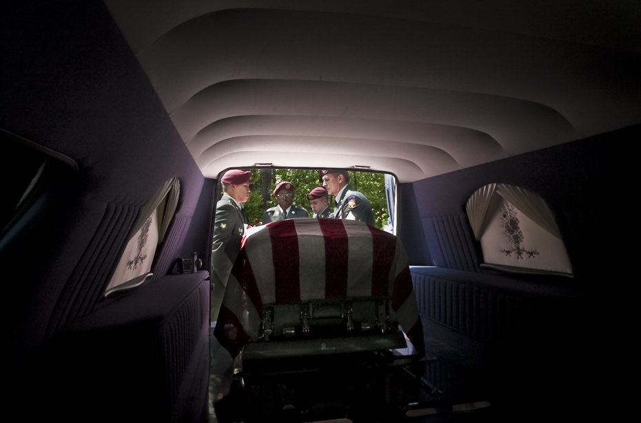20040510045 A honor guard removes the casket of Esau Patterson Jr. at the family cemetery in Ridgeland, SC. Patterson died in Baghdad, Iraq, when a vehicle approached his unit and the driver detonated a bomb. He was assigned to 4th Battalion, 27th Field Artillery Regiment, 1st Armored Division, Baumholder, Germany. Died on April 29, 2004.