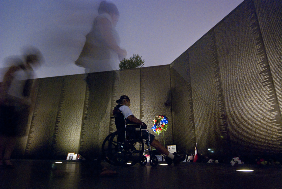 20070525070 A wheelchair bound veteran visits the Vietnam Veteran's Memorial, also known as "The Wall."