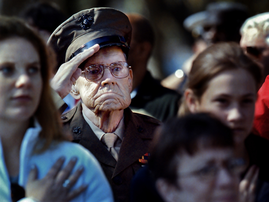 Old Soldier Retired Marine Master Sgt. Charles Mullins of Beaufort, SC salutes the playing of the "Star Spangled Banner" during Veterans Day at the national cemetery in Beaufort.